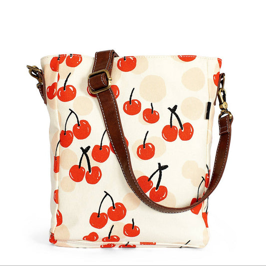 Handbag with cherry pattern on a white background
