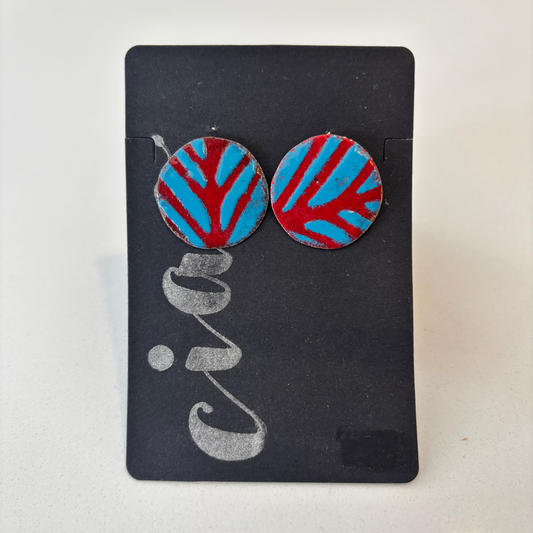 Pair of round earrings with red and blue striped design