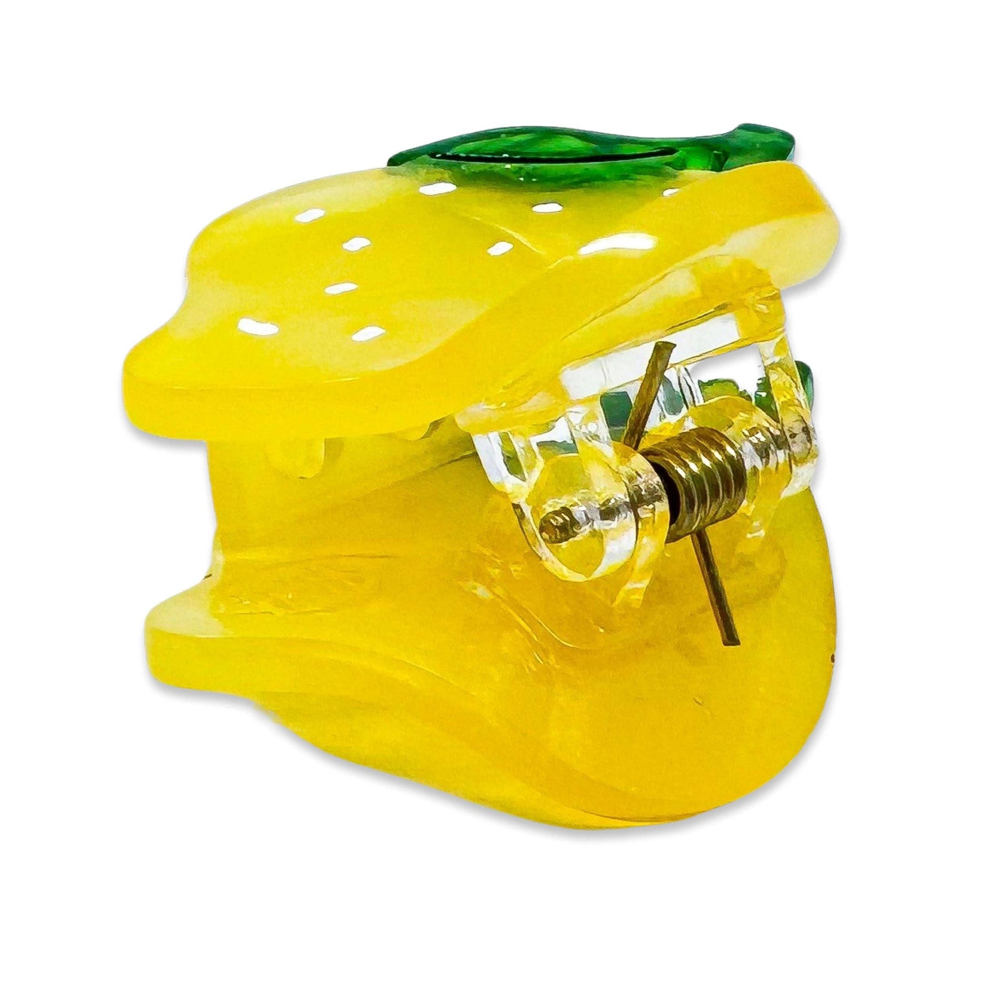 Yellow lemon-shaped object with a clear center on a white background