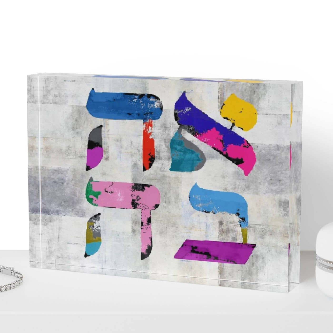 Colorful abstract art piece on a white surface