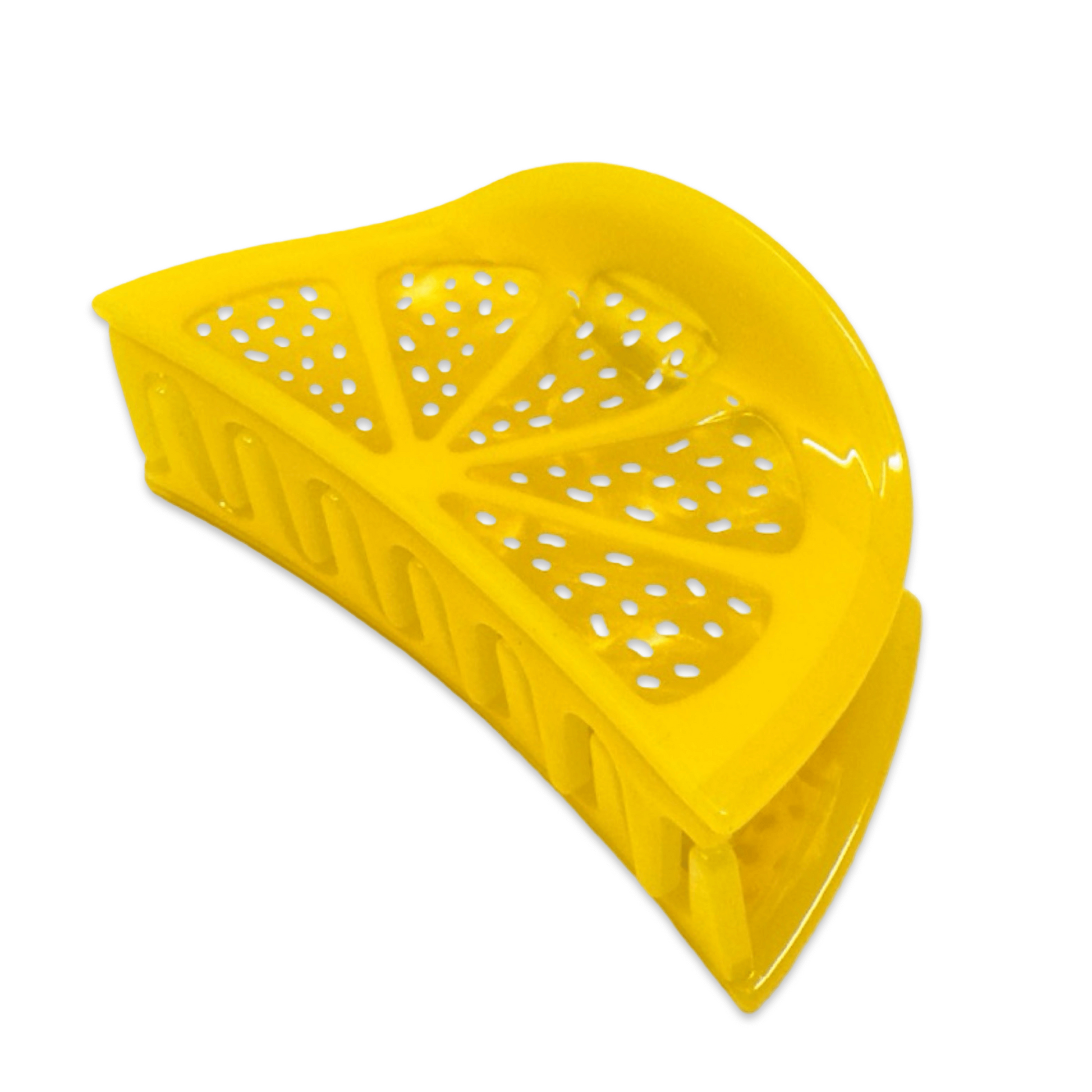 Yellow plastic wedge with cut-out design on a white background