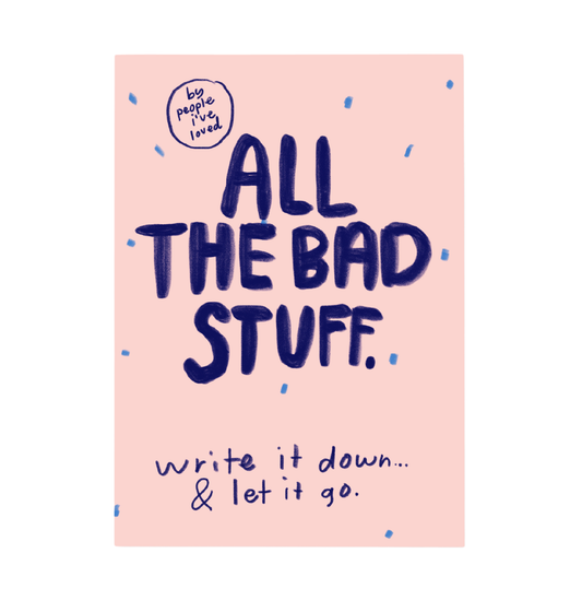 Notebook cover with text 'All the bad stuff. Write it down & let it go.' on a pink background.
