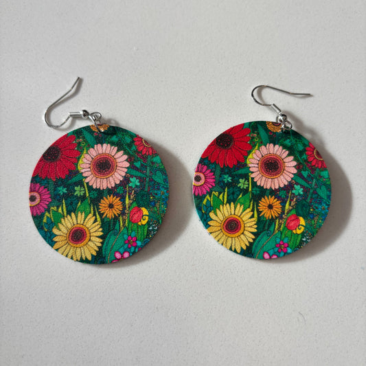 Colorful floral earrings on a light gray background