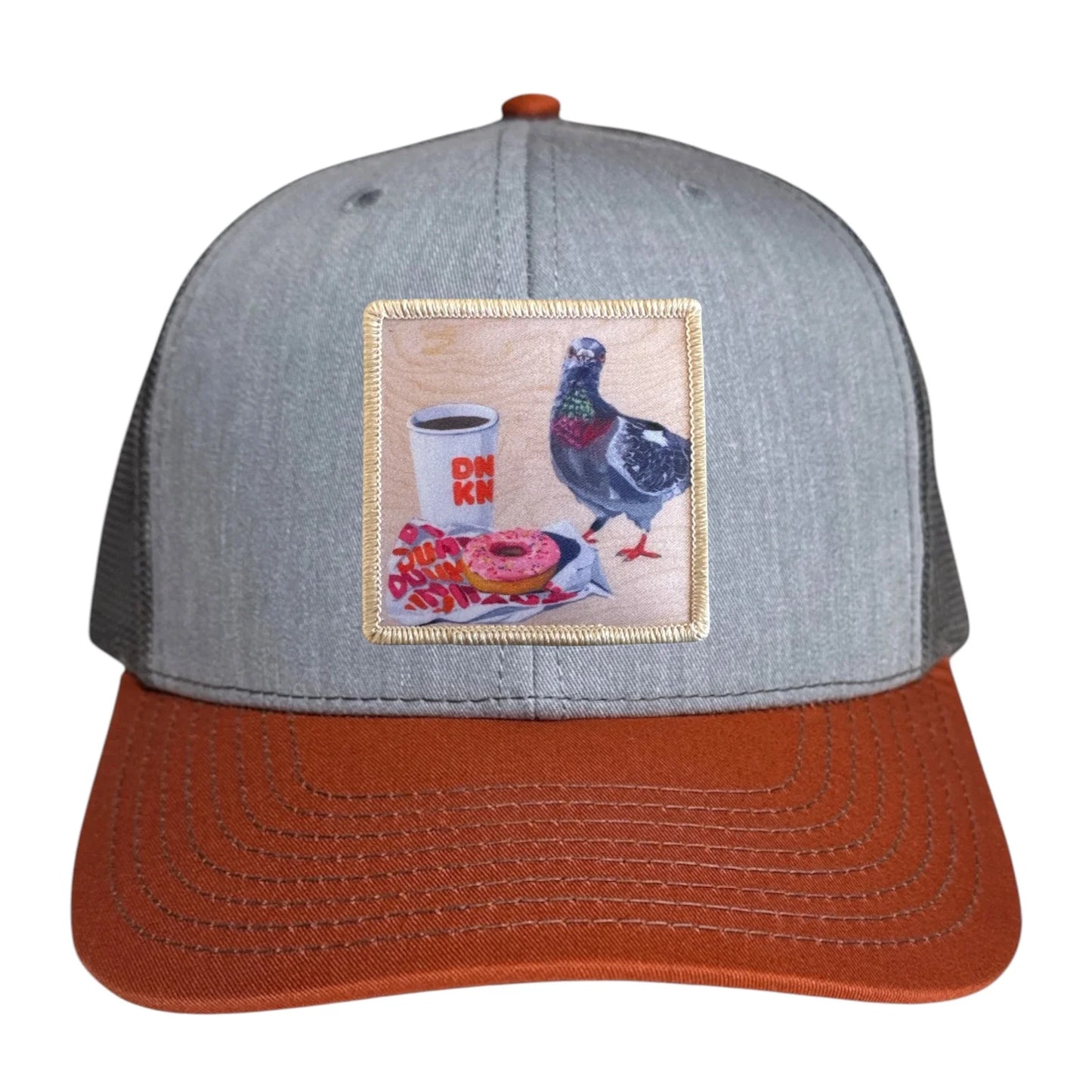 flyn_pigeons_run_on_dunkin_orange_trucker_hat