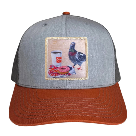 flyn_pigeons_run_on_dunkin_orange_trucker_hat