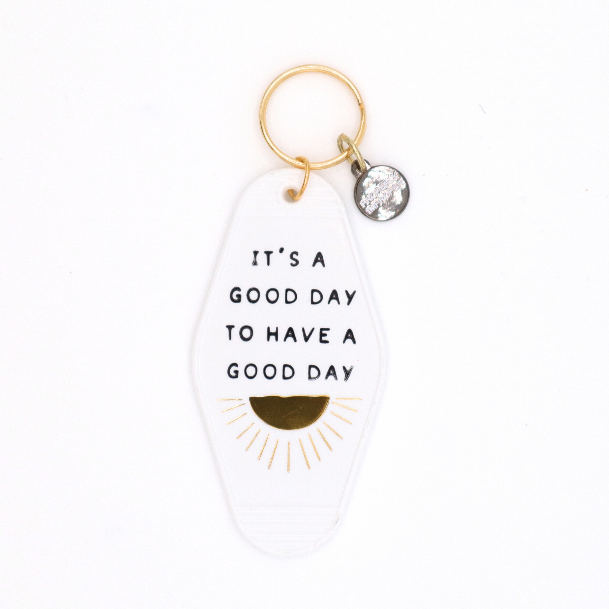 Keychain with motivational quote on a white background
