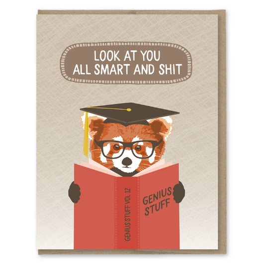 Card with a red panda wearing a graduation cap and reading a book titled 'Genius Stuff'.
