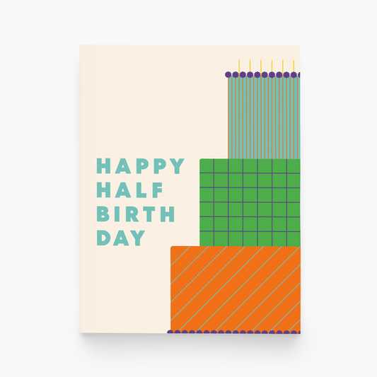 Colorful birthday card with geometric design and 'Happy Half Birthday' text on a beige background