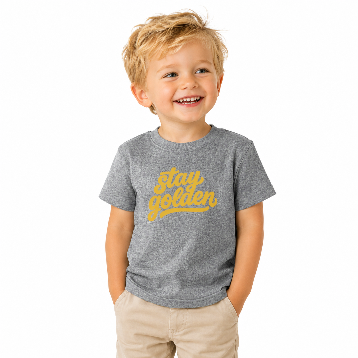 Child wearing a gray t-shirt with 'stay golden' text on a white background