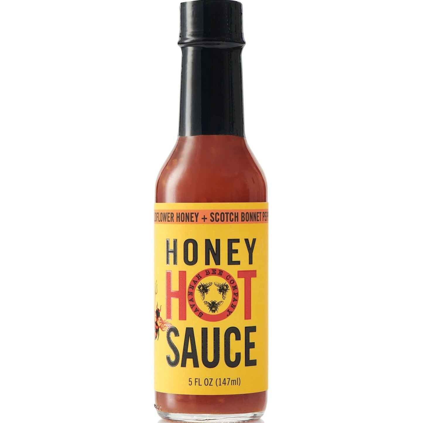 Bottle of honey hot sauce with a yellow label on a white background