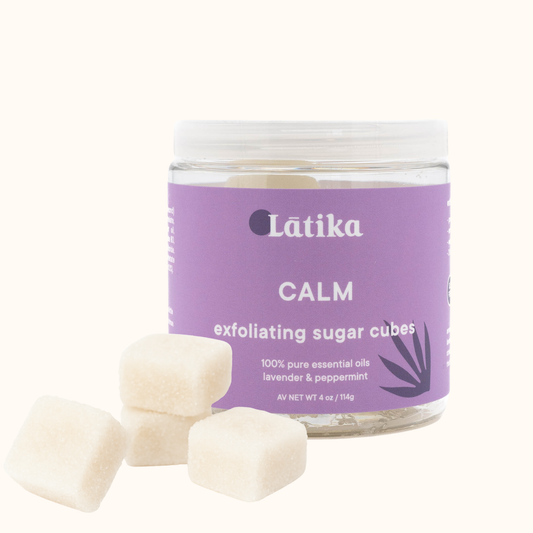 Jar of Latika Calm exfoliating sugar cubes on a white background