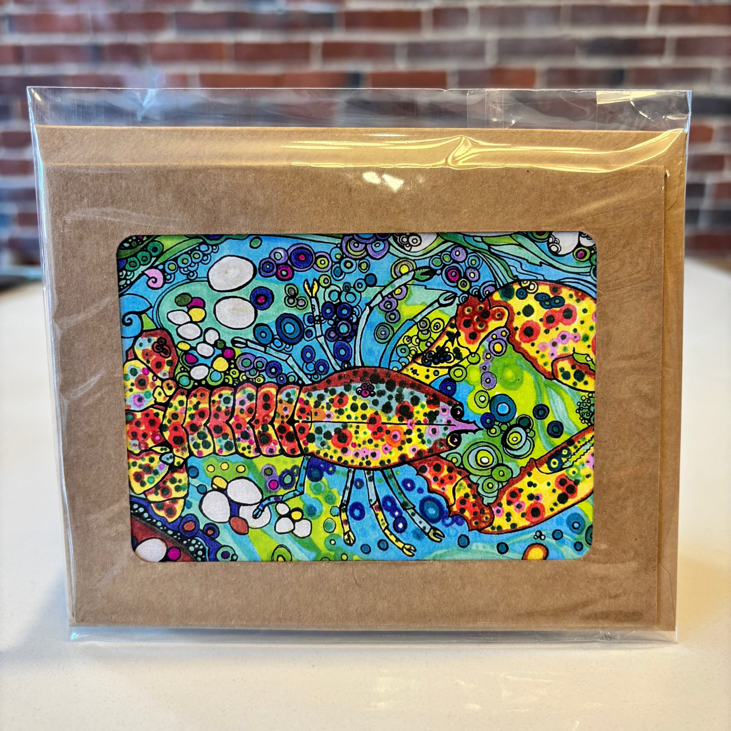 a colorful card with a lobster on it