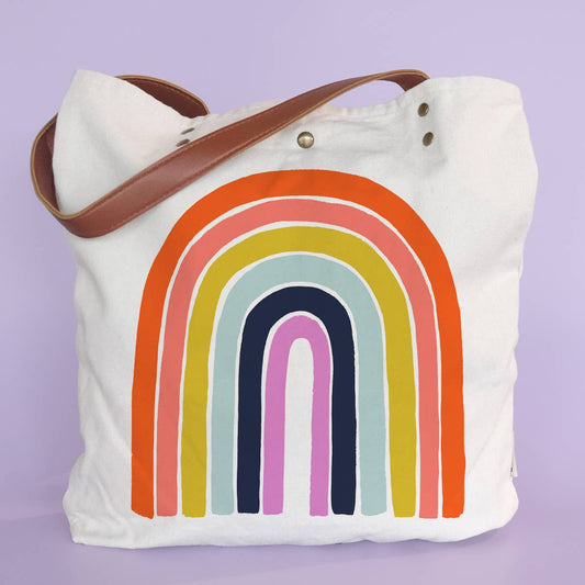 Tote bag with a rainbow design on a light purple background
