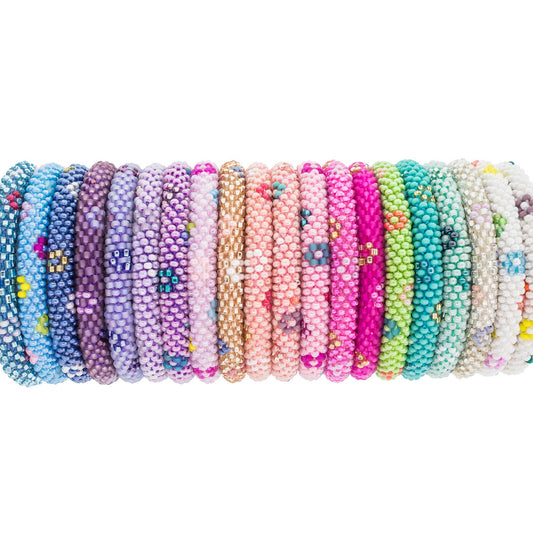 Set of colorful beaded bracelets on a white background