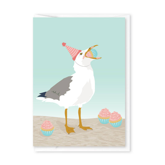 Illustration of a seagull wearing a party hat with two cupcakes on a light blue background
