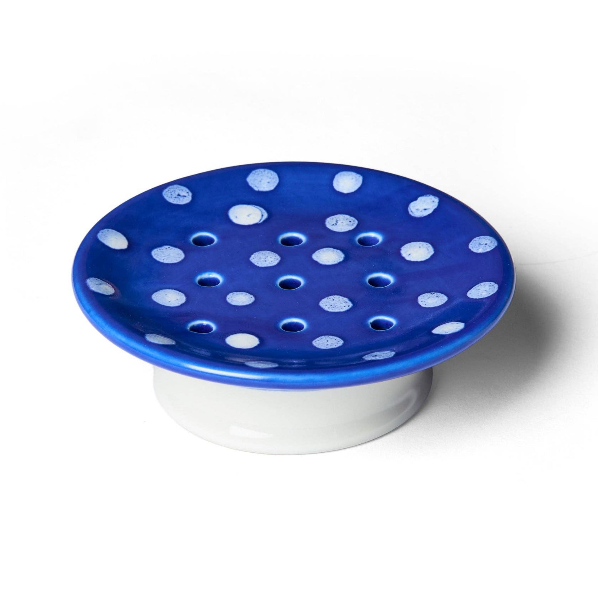 Blue polka dot dish on a white background