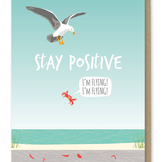 Card with a seagull and text 'Stay Positive, I'm flying! I'm flying!' on a beach background.