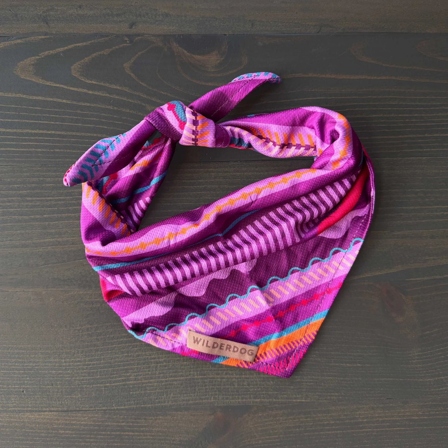 Colorful patterned headband on a wooden surface