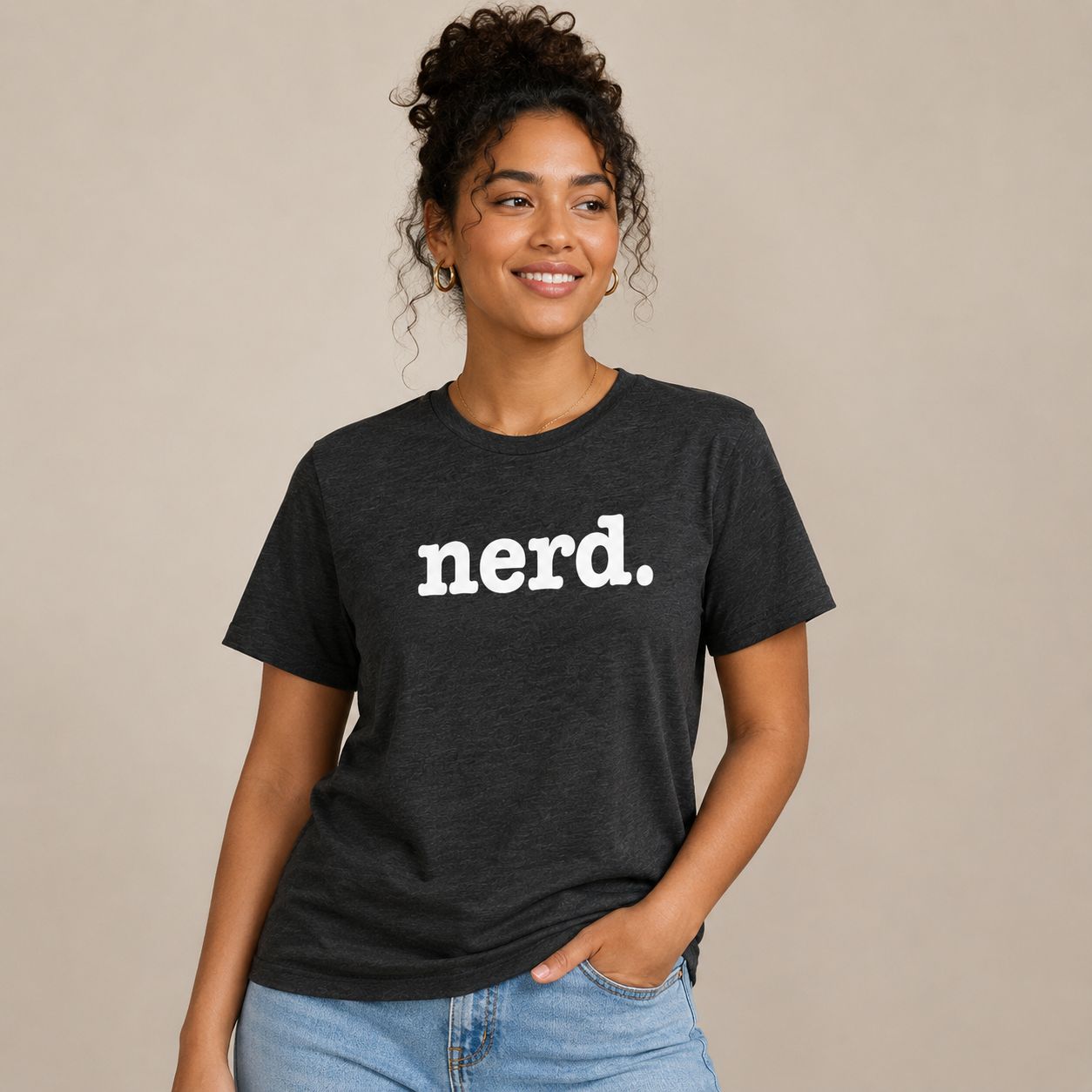Person wearing a black t-shirt with 'nerd.' text on a beige background