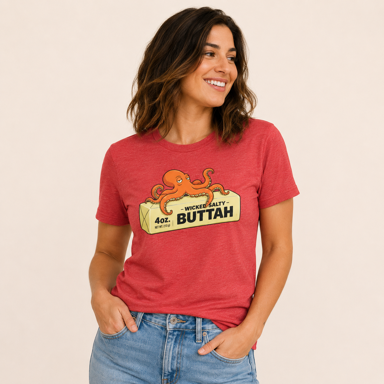 Woman wearing a red t-shirt with an octopus graphic and text on a beige background